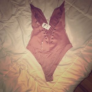 Onesie with low cleavage and open back